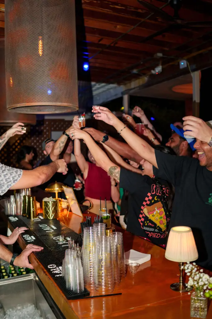 Guests raising their glasses together at Zoko Collective